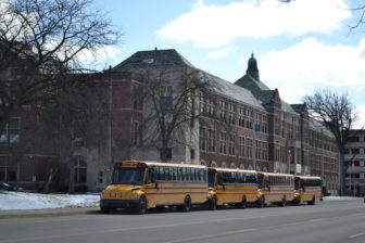 Lansing public school buses line up outside of Eastern High School on March 15, 2016. Photo by Taylor Skelton