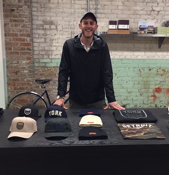 Josh York, of York Project, sets up a pop-up shop booth at Shinola in Detroit on Nov. 5, 2017.