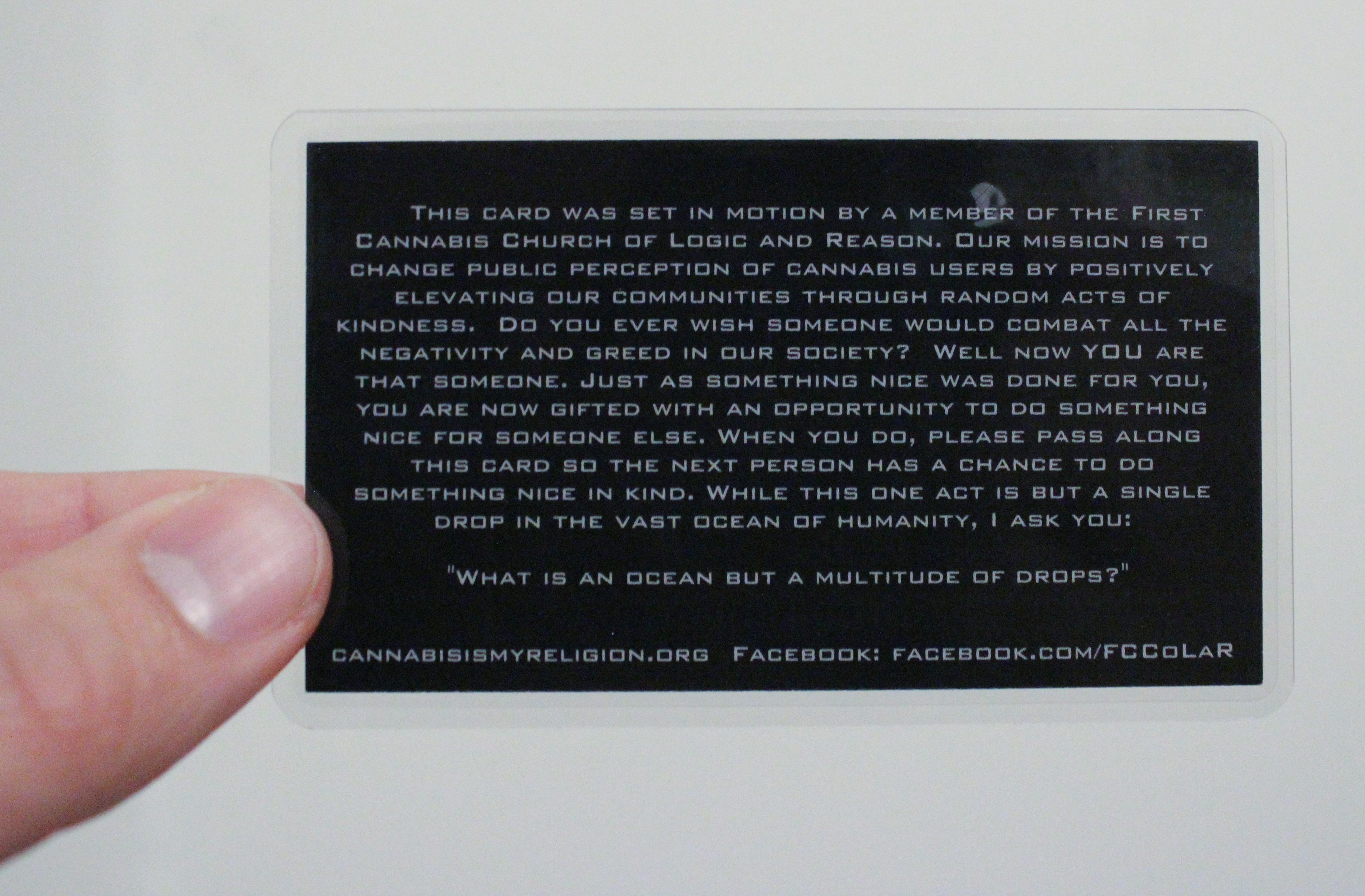 The back of a First Cannabis Church card details the mission of the organization’s pay-it-forward campaign.