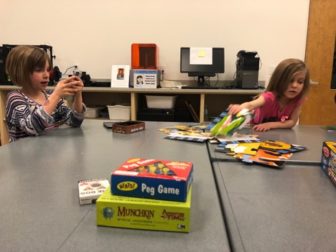 Anna Montgomery's two daughters enjoying the various game's at the East Lansing Public Library