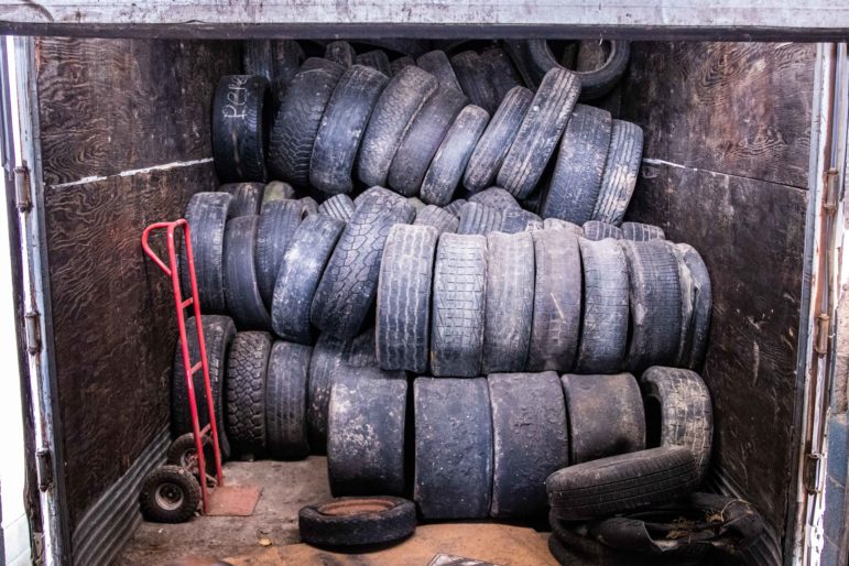 Tires to be recycled sit in a trailer outside the Lansing Recycling Center facility on Cedar Street on Dec. 12, 2018.