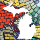 White map of Michigan superimposed on a colorful stained glass pattern