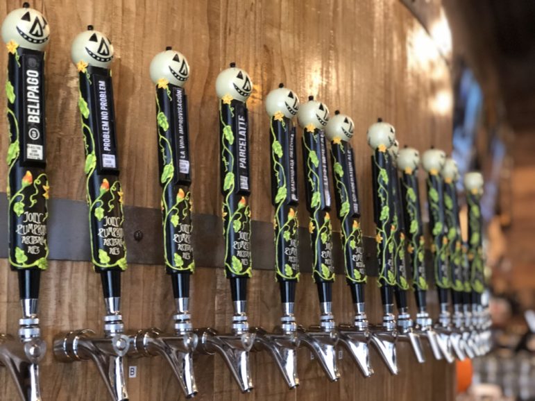 A picture of taps from Jolly Pumpkin Artisan Ales.