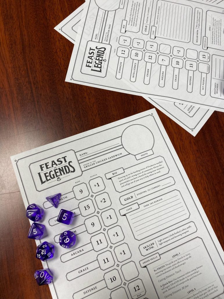 Participants in the Oct. 25 game night played Feast of Legends. The Holt-Delhi Library provides interactive game nights among residents. 