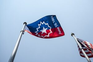 Juneteenth flag alongside U.S. flag