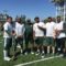 Coach Ron Burton and a few of his defensive lineman stop for a picture during the 2016 Michigan State Women's Clinic.