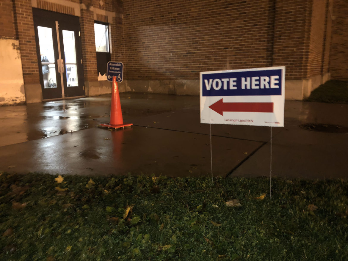 A sign points voters to the precinct at Lansing's Foster Community Center. Lansing voters were asked whether to annex about 11 acres of land from Delta Township.