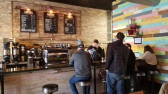 Blue Owl Coffee's REO Town location includes a bar where customers can sit and drink coffee.