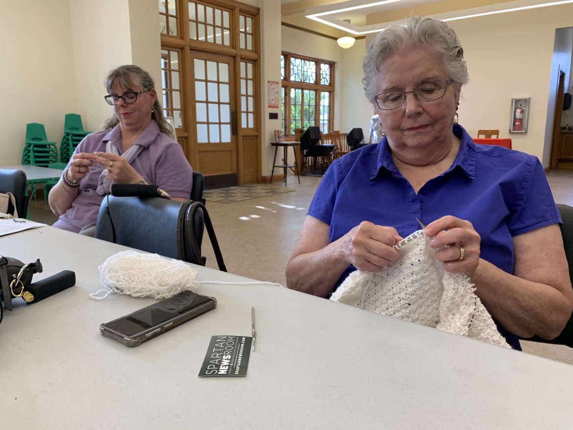 Grand Ledge area women meet to knit as part of the Crafting with a Cause group. They work on items such as blankets for those in need.