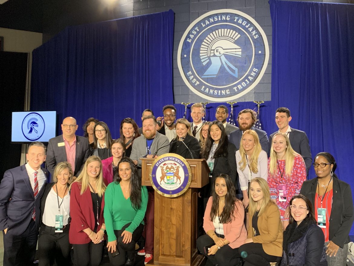 East Lansing High School students and staff pose for a photo Tuesday. Michigan Gov. Gretchen Whitmer delivered a Democratic response to the State of the Union address from the school.