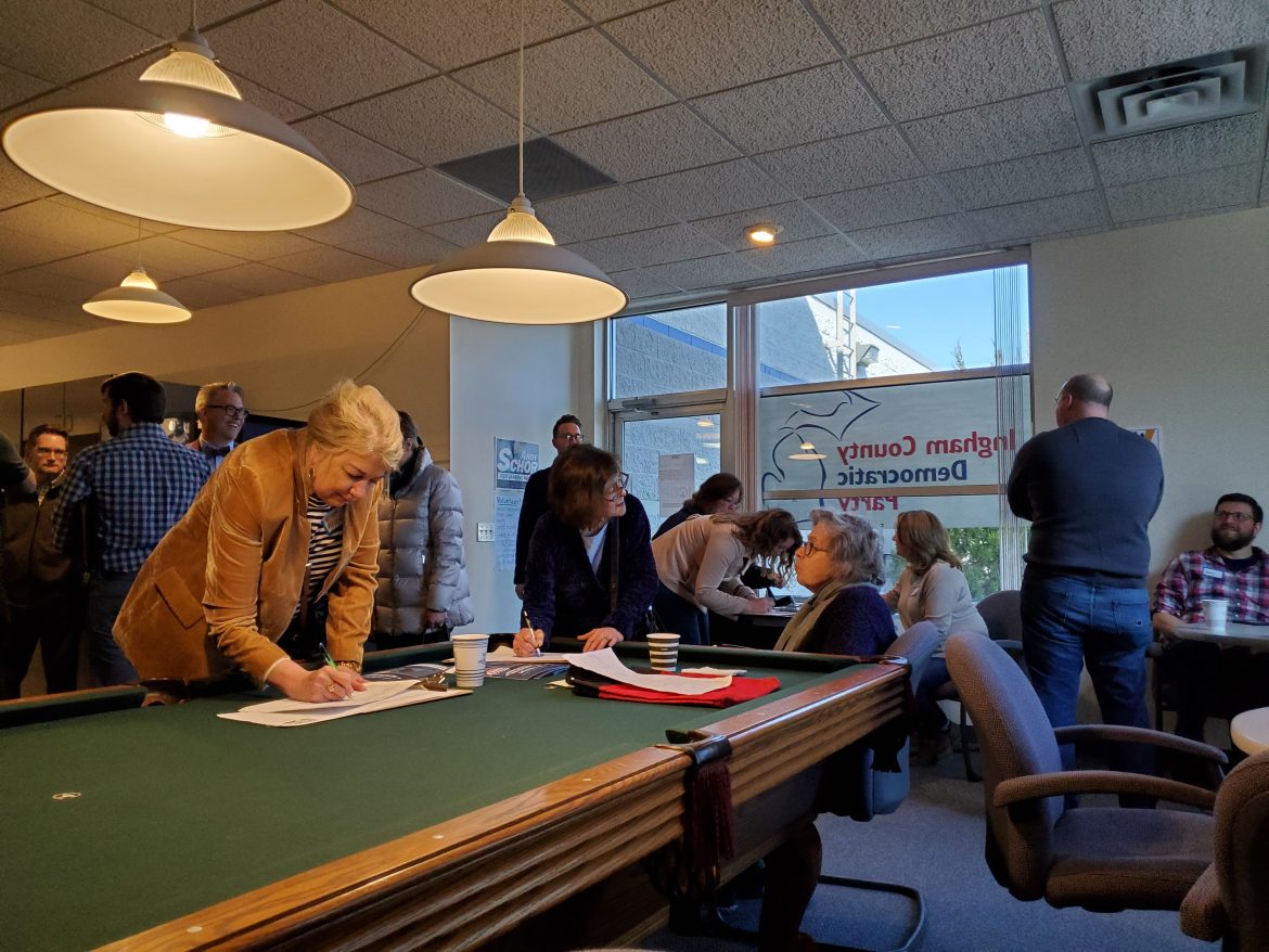 The Ingham County Democratic Party collects signatures for candidates running for local offices at its Feb. 23 field office opening.