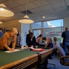 The Ingham County Democratic Party collects signatures for candidates running for local offices at its Feb. 23 field office opening.