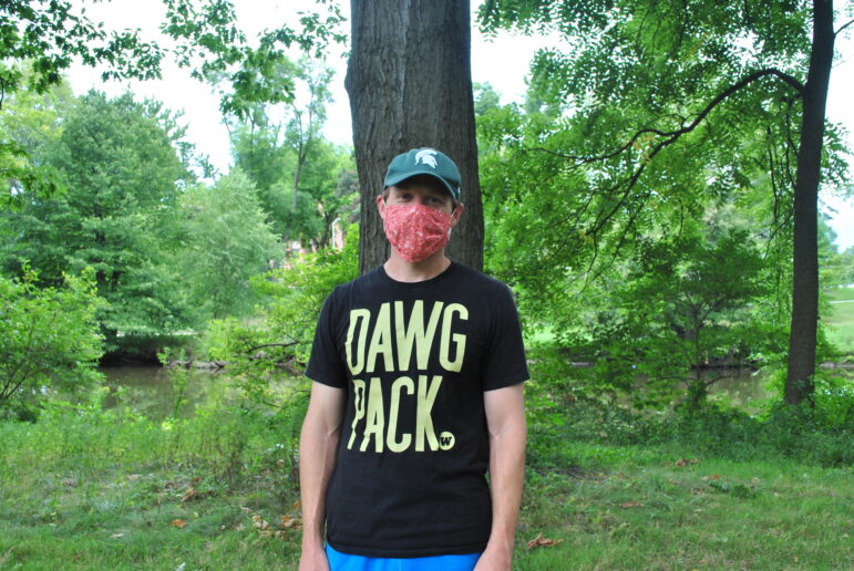 Michigan State professor David Stroupe hikes near the Red Cedar River.