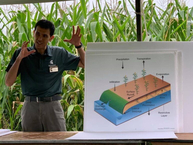 MSU Extension drainage specialist Ehsan Ghane discusses controlled drainage strategies for farms at the Lenawee County Center for Excellence field day in August. Roughly 500 farmers attended.