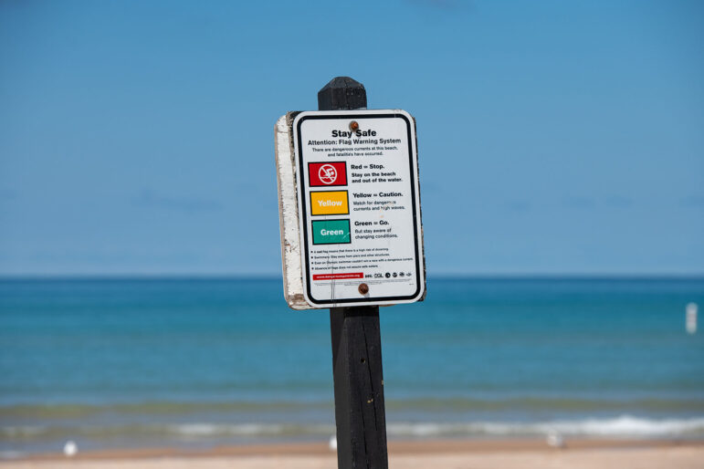 Beach flag warning system signage at Mears State Park. 