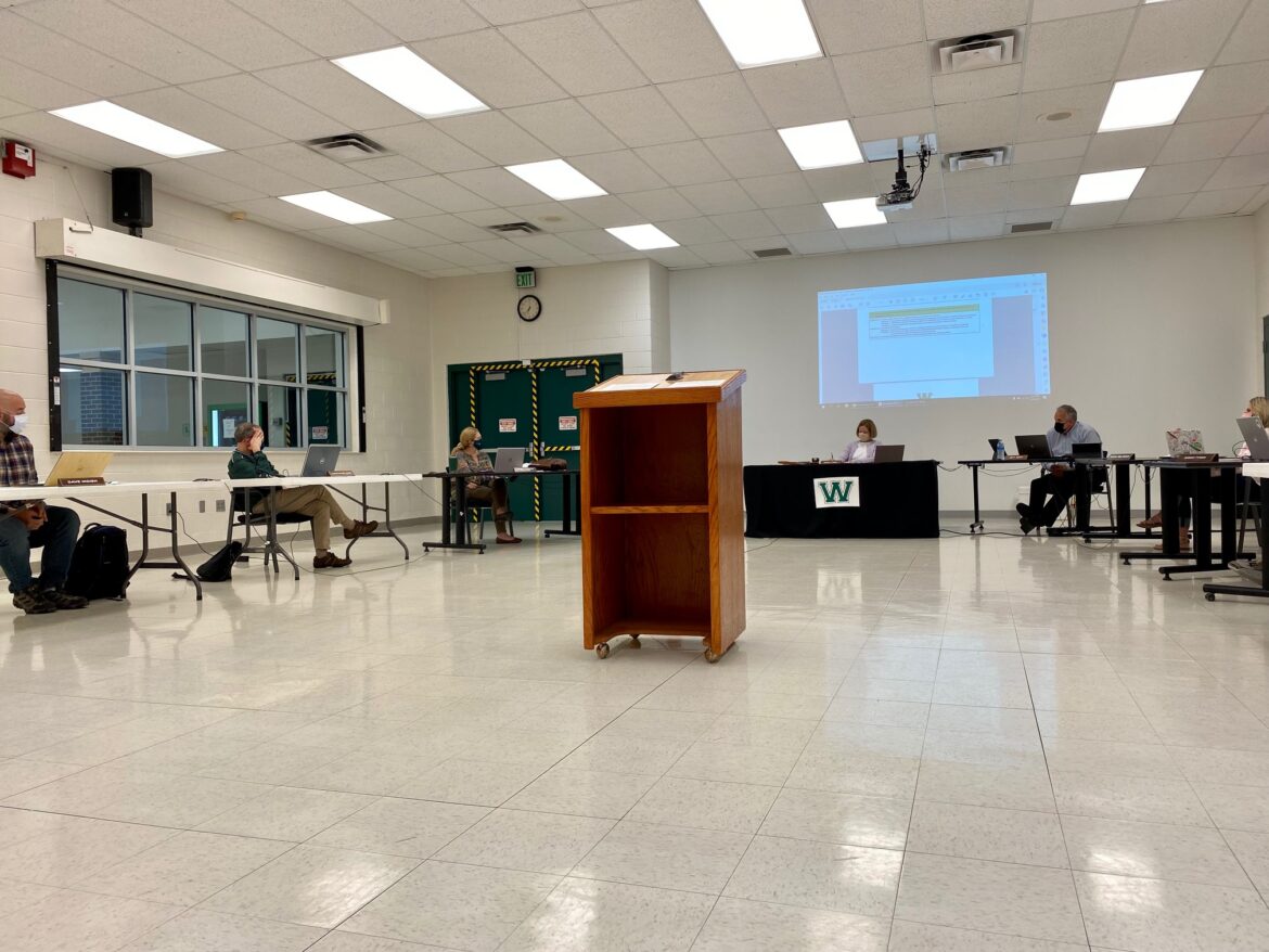 Williamston Community Schools Board of Education members sit and discuss agenda topics, during the Board of Education meeting held on Oct. 4, in Williamston Middle School.