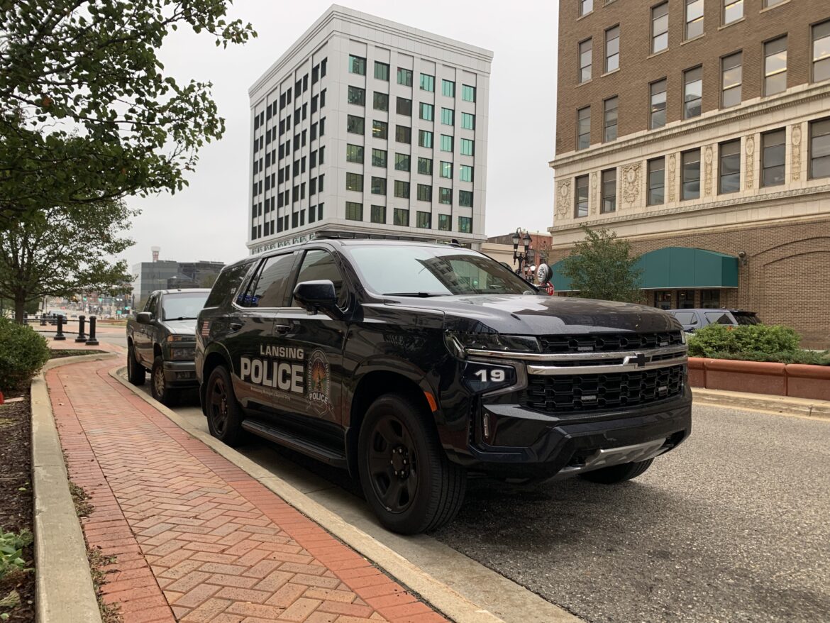 A Lansing Police Department cruiser sits outside the department’s downtown headquarters. Department officials say they will be able to more effectively protect officers thanks to ballistic shield upgrades paid for a the $13,114 donation