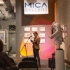 Emily Dievendorf presents their slam poetry at the “Women’s Writes” event organized by The Creative Collective and the Artist’s Umbrella, hosted at the MICA Gallery in Old Town Lansing.