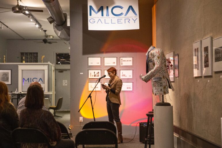 Emily Dievendorf presents their slam poetry at the “Women’s Writes” event organized by The Creative Collective and the Artist’s Umbrella, hosted at the MICA Gallery in Old Town Lansing.