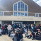 Students gather outside of the main entrance at Holt High School on Wednesday, Nov. 3 at 11:50 a.m.