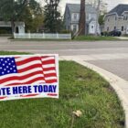 A "vote here today" sign outside a polling place in Lansing for the November 2021 election.