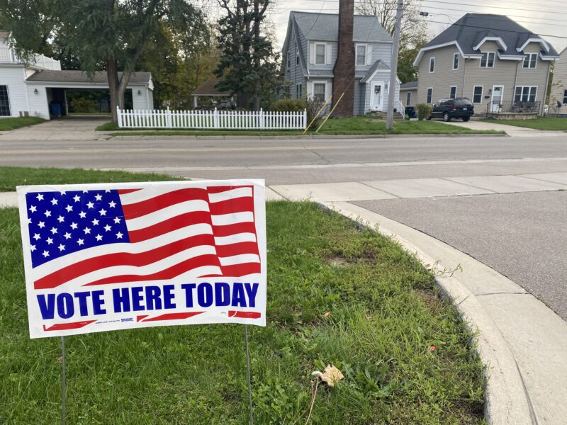 A "vote here today" sign outside a polling place in Lansing for the November 2021 election.