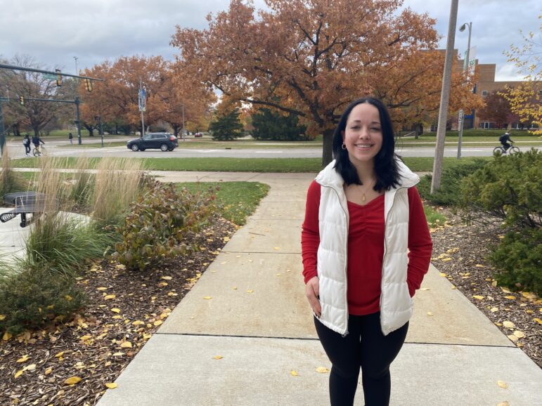Sabrina Seldon smiles outside of the Communication Arts and Sciences Building.