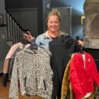 Julie Knop displays what coats she has left to give away.