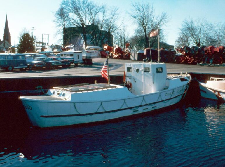 Motor lifeboat CG 40300 is shown docked in Escanaba in 1975.