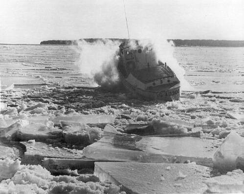CG 40300 works the ice on Lake Michigan around 1970.