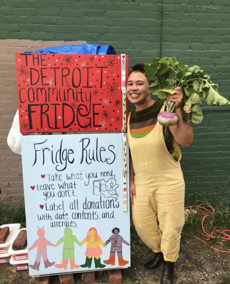 Alyssa Rogers, a co-founder of the Detroit Community Fridge, in front of one of the group’s refrigerators.