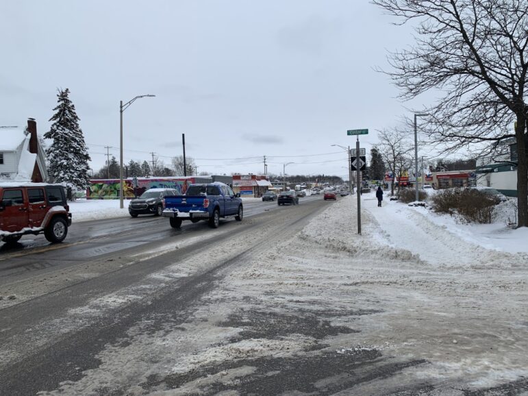 Cars driving on recently cleared Grand River Avenue