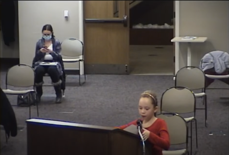 Child speaks at podium
