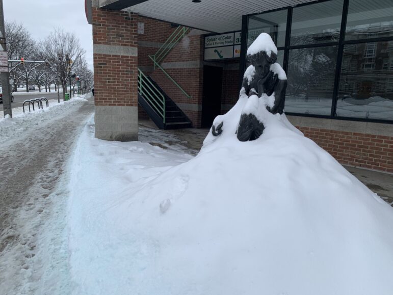 Snow covers the statue outside of Bubble Island on Grand River Avenue