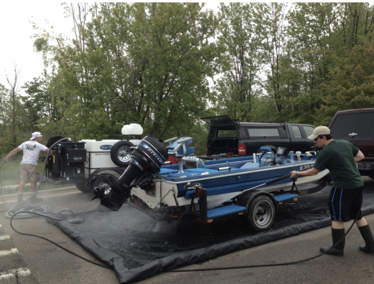 A portable boat wash operating at Lake Ovid in Clinton County.