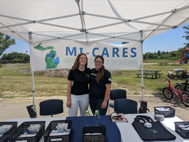Community activists at the Pittsfield Farmers Market offer information about MI-CARES.