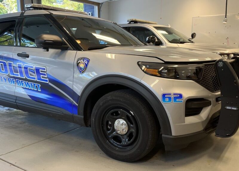 A side view of a DeWitt Police Department patrol car