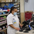 Bianca Doniver, manager of the pharmacy at Walmart in White Lake, works on a computer at the retail counter.