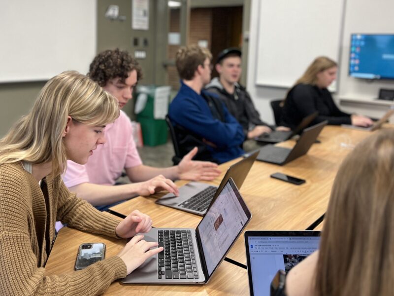 Abe Frank and Grace Cannon working with other students and looking at satellite imagery during a Human Rights Lab meeting. The meeting took place on Nov. 4, with students discussing progress on their Libya project for the International Criminal Court.