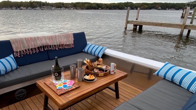 A Lilypad boat is loaded with snacks and beverages.