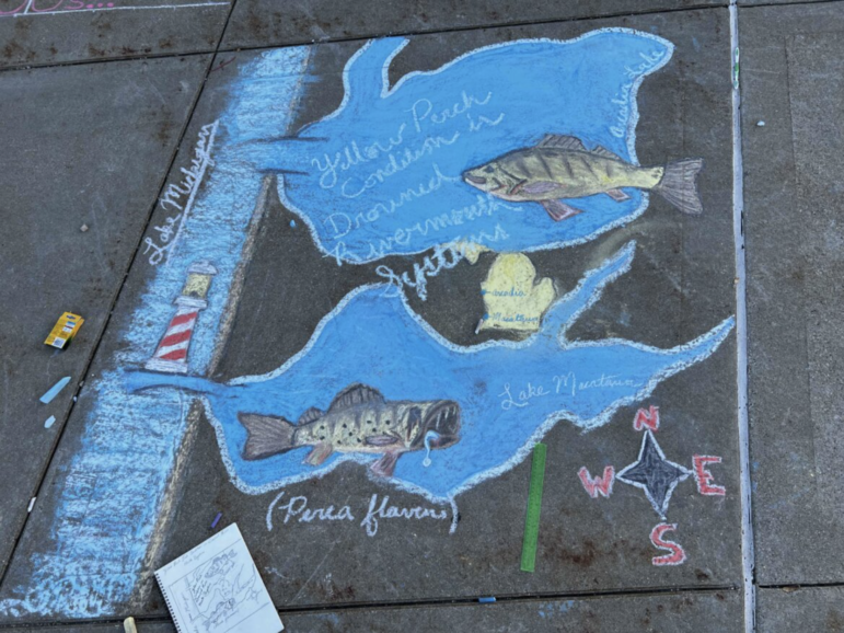 Jacob Yingling’s chalk mural took him two hours to create and many more hours to plan. It reads, “Yellow Perch Condition in Drowned Rivermouth System.”