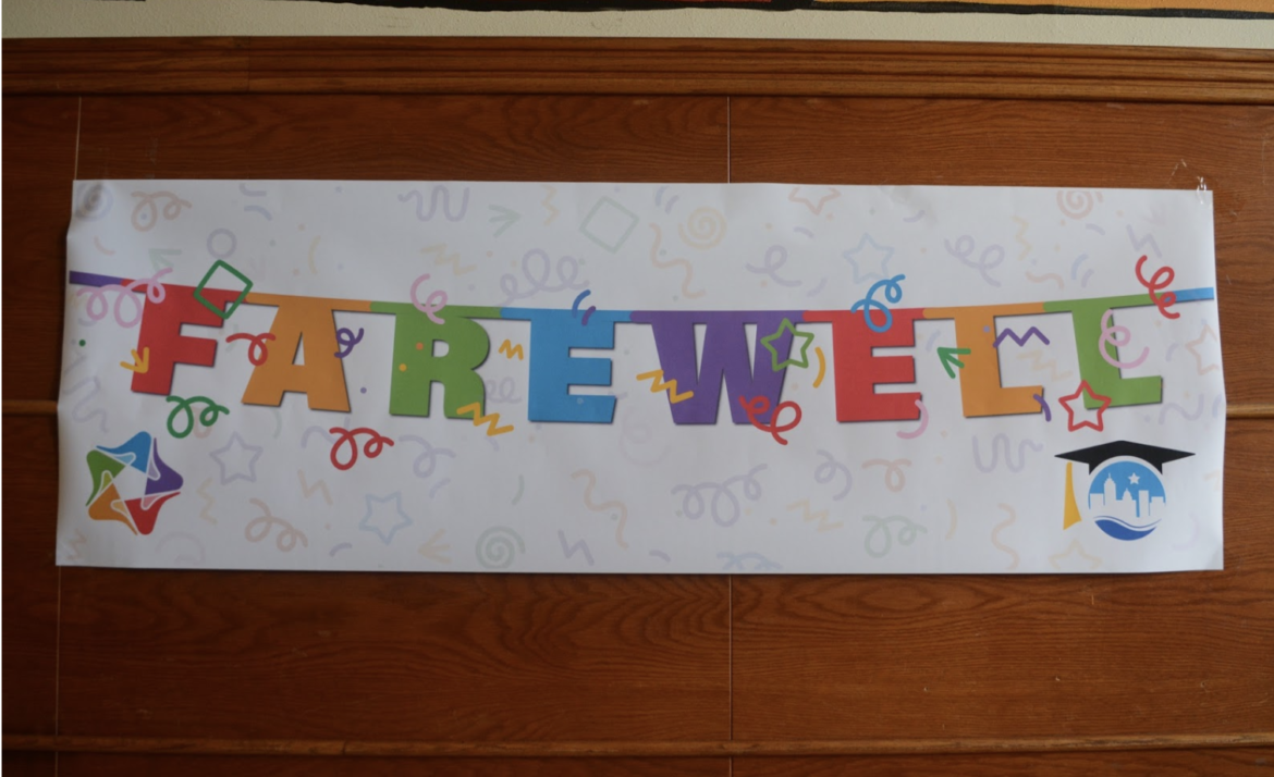A paper banner in the school says "Farewell."