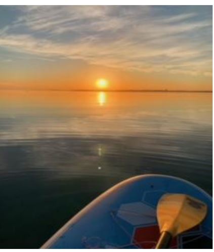 Sunrise paddleboard at East Bay Park in Traverse City.