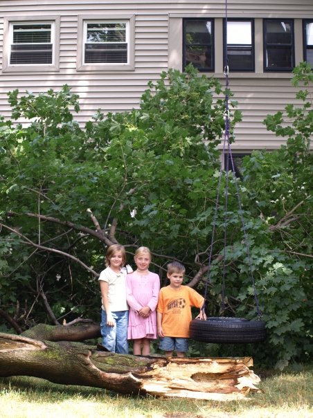 Molly Wright (left) Grace Huber (middle) and Sean Wright (right) pose with tire swing and downed maple branch.