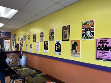 Vintage posters line the walls of Groovy Donuts in Williamston.