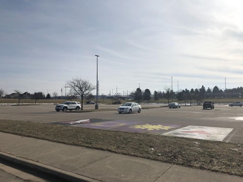 A nearly empty parking lot at Okemos High School on Feb. 8, 2023. Classes were canceled Wednesday in response to a swatting call reporting a shooting at the school on Feb. 7, 2023.