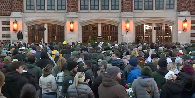 A vigil is held at the Auditorium following the mass shooting at MSU.