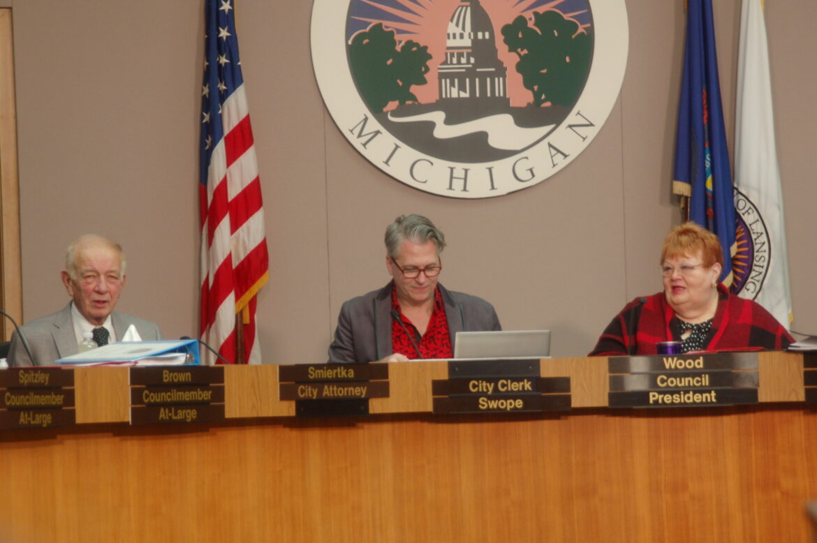 (From left to right) Jim Smiertka, Chris Swope and Carol Wood discussing the meeting agenda before a City Council meeting on Jan. 23, 2023. Photo by Katie Finkbeiner.