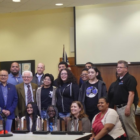 The Everett High School Robotics Club and Lansing School District Board of Education Members. By: Jiazhi Chen