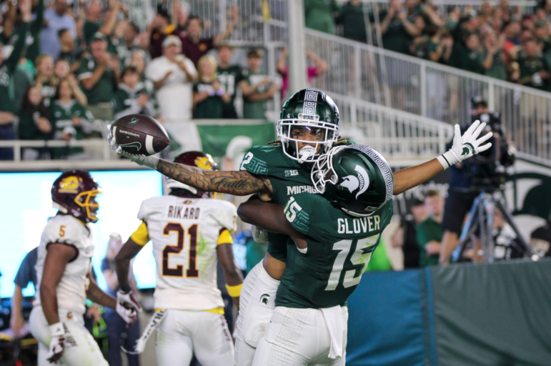 MSU WR Tyrell Henry is hoisted into the air by WR Jaron Glover. The Spartans won over Central Michigan during the first game of the season at Spartan Stadium.